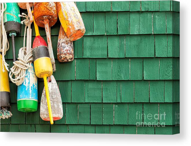 Usa Canvas Print featuring the photograph Lobster Buoys Hanging On A Green Wood by Cdrin