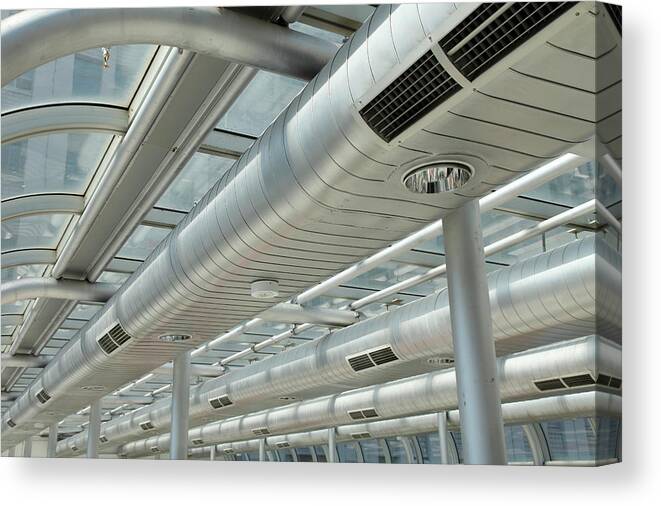 In A Row Canvas Print featuring the photograph Metallic, Shiny, Long Air Ducts by Craigrjd