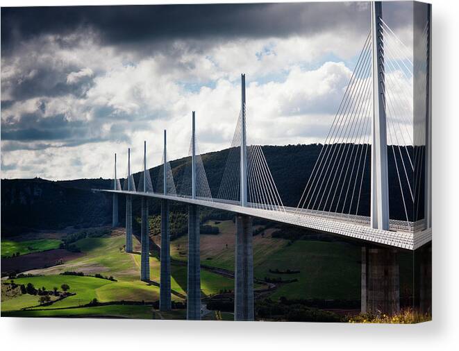Tranquility Canvas Print featuring the photograph Millau Viaduct Bridge by Walter Bibikow