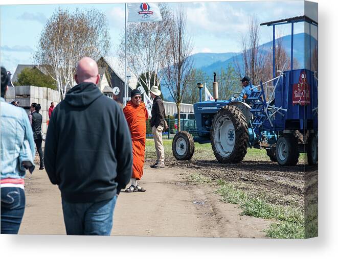 Monk And Tractor Canvas Print featuring the photograph Monk and Tractor by Tom Cochran
