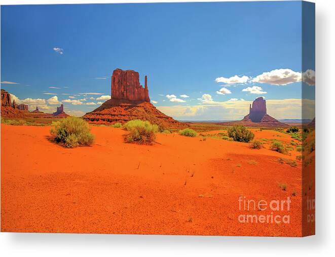 Monument Valley Where Heaven Touches Earth Canvas Print featuring the photograph Monument Valley Where Heaven Touches Earth by Felix Lai