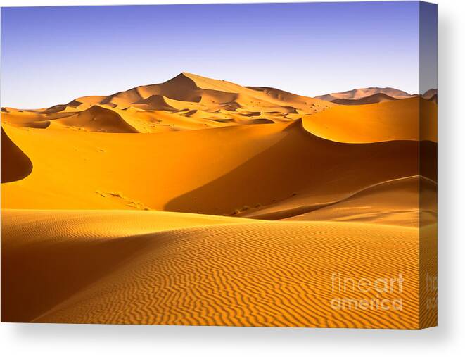 Shadow Canvas Print featuring the photograph Moroccan Desert Landscape With Blue by Apstockphoto