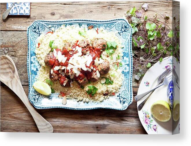 Ip_11296272 Canvas Print featuring the photograph Moroccan Lamb Meatballs On A Bed Of Couscous With Tomato Sauce, Yoghurt And Almonds by George Blomfield