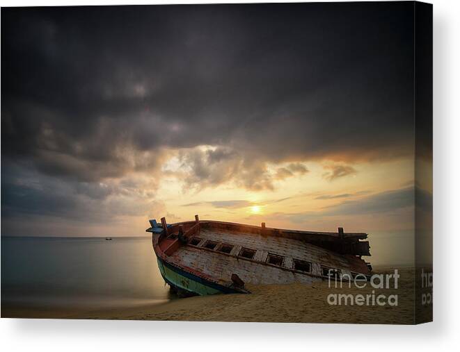 Damaged Canvas Print featuring the photograph Old And Broken Wooden Boat On Sandy by Yusri Salleh