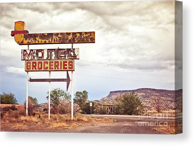 Arizona Canvas Print featuring the photograph Old Motel Sign On Route 66 Usa by Andrey Bayda