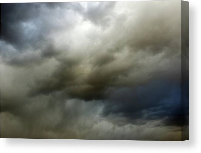 Thunderstorm Canvas Print featuring the photograph Ominous Sky Full Of Dark Clouds by Ninjamonkeystudio