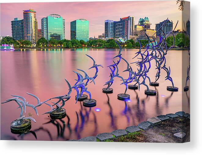 America Canvas Print featuring the photograph Orlando Skyline and Take Flight Sculptures at Sunset by Gregory Ballos