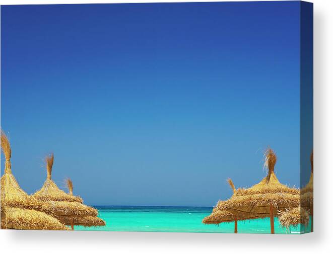 Scenics Canvas Print featuring the photograph Parasols And Beach, Rethymno, Greece by Sakis Papadopoulos