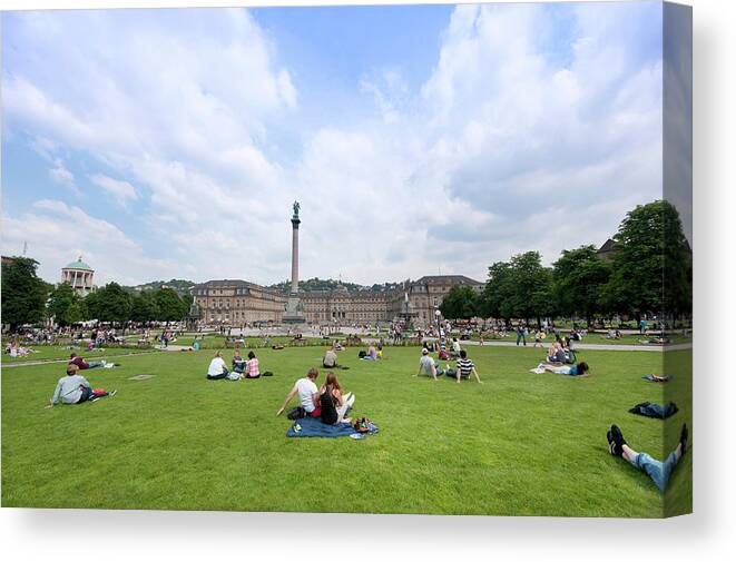Grass Canvas Print featuring the photograph People Relaxing At Schlossplatz by Thomas Winz