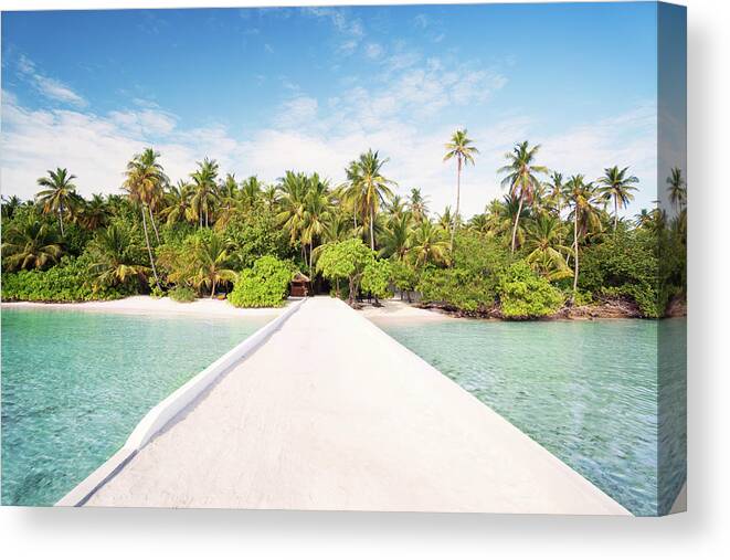 Scenics Canvas Print featuring the photograph Pier To Tropical Island In The Maldives by Matteo Colombo
