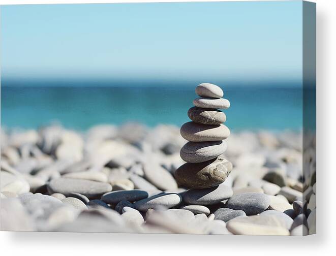 French Riviera Canvas Print featuring the photograph Pile Of Stones On Beach by Dhmig Photography