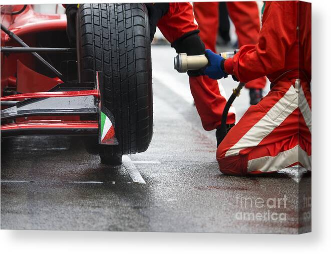 Quick Canvas Print featuring the photograph Professional Racing Team At Work by Corepics Vof