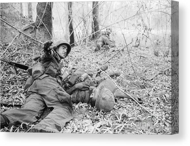 Vietnam War Canvas Print featuring the photograph Radioman Calling For Aid For Wounded Man by Bettmann