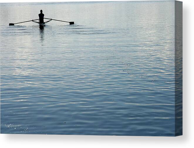 Young Men Canvas Print featuring the photograph Rear View Of A Man Rowing A Boat by Ggwink