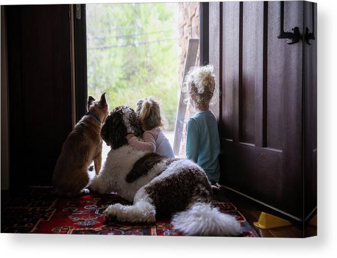 Sisters Canvas Print featuring the photograph Rear View Of Sisters Sitting With Dogs At Doorway by Cavan Images