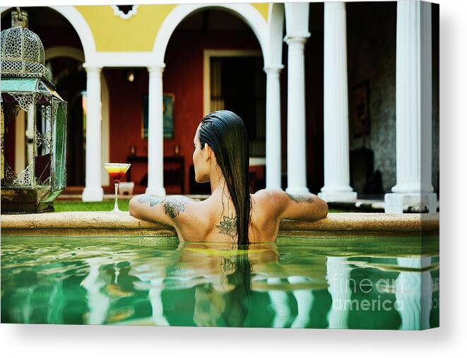 Spa Canvas Print featuring the photograph Rear View Of Woman Relaxing On Edge by Thomas Barwick