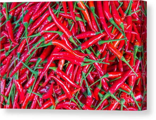 Pepper Canvas Print featuring the photograph Red Chillies For Sale At Marketthailand by Jat306