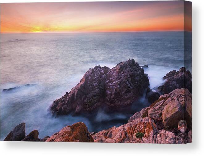 Scenics Canvas Print featuring the photograph Rocks In Sea At Sunset by Sean Duan