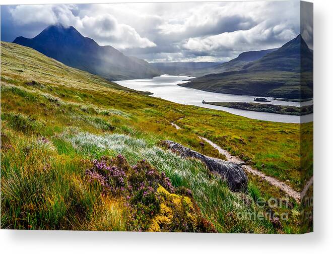 Cliffs Canvas Print featuring the photograph Scenic View Of The Lake And Mountains by Martin M303