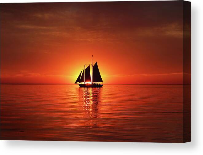Edith M. Becker Canvas Print featuring the photograph Schooner Eclipses the Sunset by David T Wilkinson