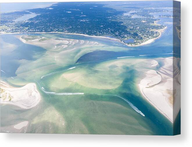 Landscapeaerial Canvas Print featuring the photograph Small Boats Navigate A Channel by Ethan Daniels