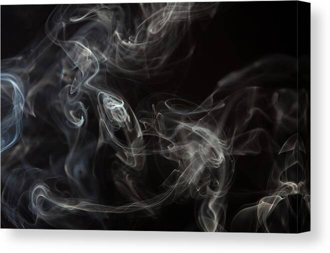 Black Background Canvas Print featuring the photograph Smoke Curls Against Black Background by Jasper James