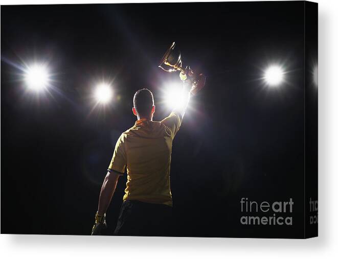 Soccer Uniform Canvas Print featuring the photograph Soccer Player Holding Golden Cup by Stanislaw Pytel