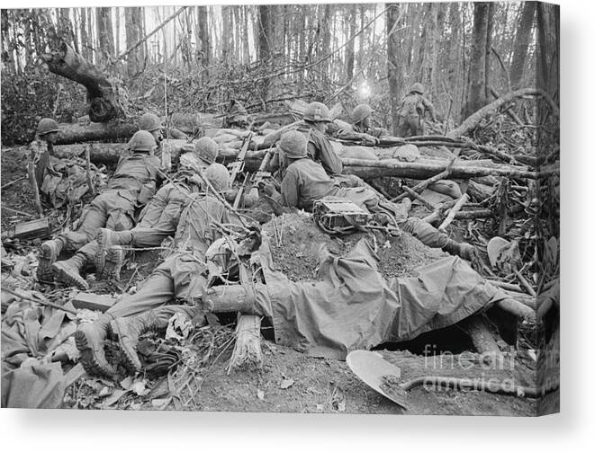 Vietnam War Canvas Print featuring the photograph Soldiers Engaged In Long Crawl To Crest by Bettmann