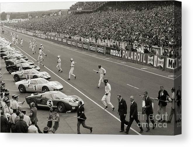 People Canvas Print featuring the photograph Start Of The Le Mans Race by Bettmann