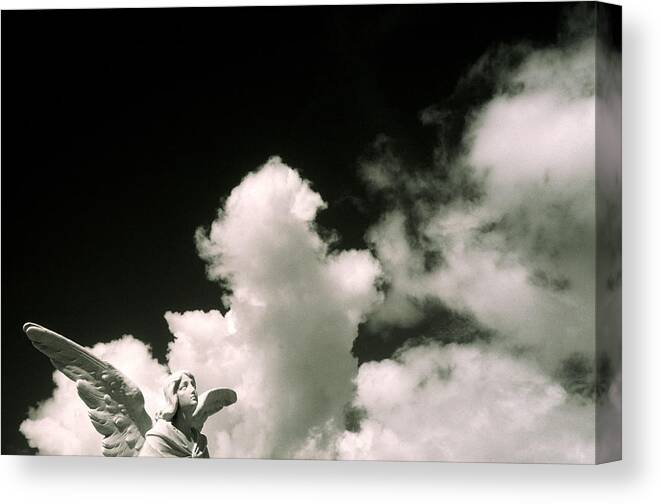 Statue Canvas Print featuring the photograph Statue Of Angel Against Cumulus Clouds by Stuart Westmorland