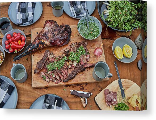 Beef Canvas Print featuring the photograph Summer Barbecue Spread With Steak, Venison And Chimichurri by Cavan Images