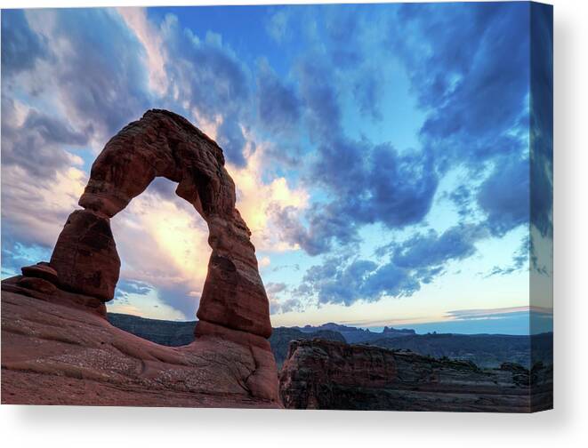 Scenics Canvas Print featuring the photograph Sunset At Delicate Arch In Arches by Rachid Dahnoun