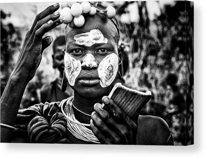 Face Paint Canvas Print featuring the photograph Surma Woman Painting Her Face - Ethiopia by Joxe Inazio Kuesta Garmendia
