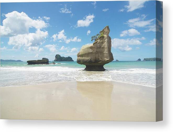Tranquility Canvas Print featuring the photograph Te Horo Rock, Cathedral Cove by Robin Galloway
