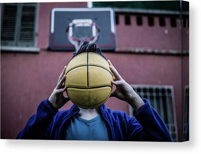 Handsome Canvas Print featuring the photograph Teenager Holding Ball by Vivida Photo PC