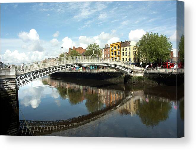 Dublin Canvas Print featuring the photograph The Famous Hapenny Bridge In Dublin by Stevenallan