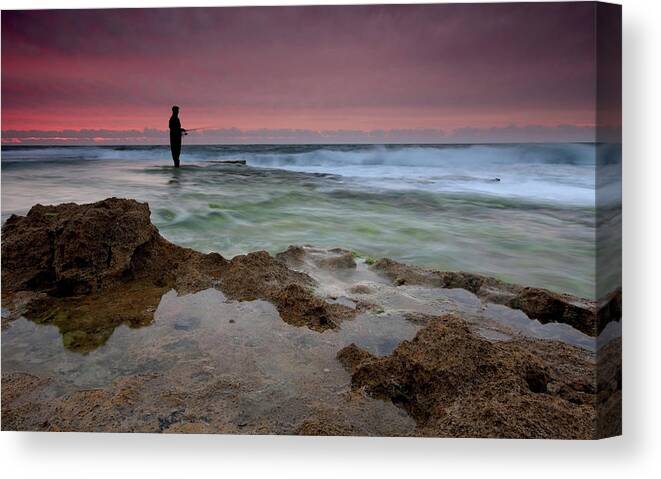 Fishing Canvas Print featuring the photograph The Lone Fisherman by Amnon Eichelberg