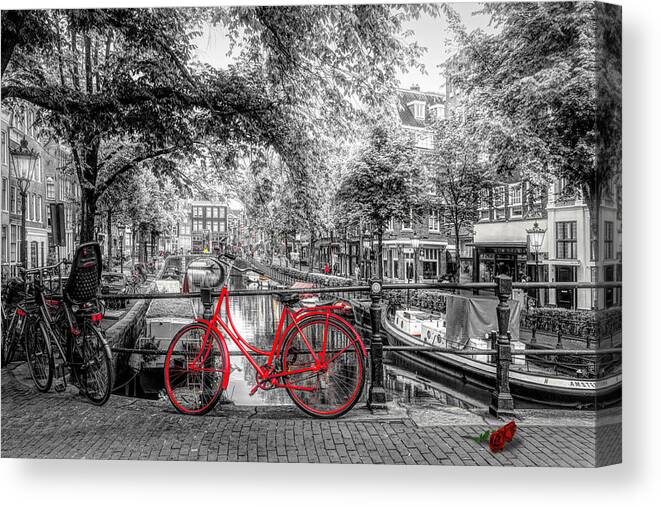 Boats Canvas Print featuring the photograph The Red Bike in Amsterdam in Color Selected Black and White by Debra and Dave Vanderlaan