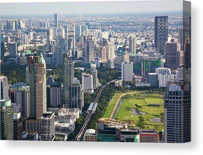 Population Explosion Canvas Print featuring the photograph The Skyscrapers Of Bangkok by Tom Bonaventure