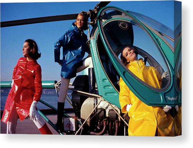 #new2022 Canvas Print featuring the photograph Three Models Around A Helicopter by Gene Laurents
