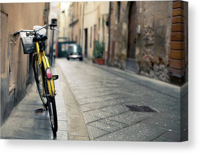 Architectural Feature Canvas Print featuring the photograph Vintage Bycicle Leaning On The Wall by Zodebala