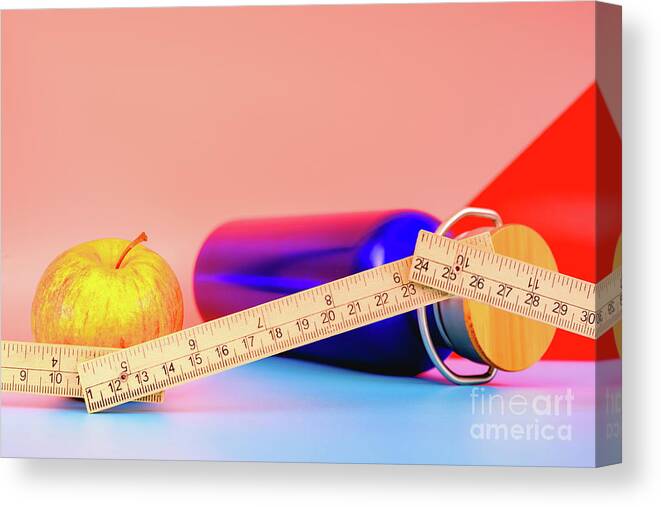 Apple Canvas Print featuring the photograph Water bottle, apple and measuring tape isolated on colorful background in studio, healthy life concept. by Joaquin Corbalan