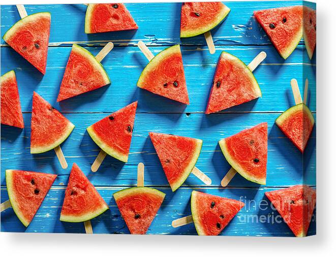 Ice Canvas Print featuring the photograph Watermelon Slice Popsicles On A Blue by I Am Kulz
