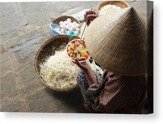 Three Quarter Length Canvas Print featuring the photograph Woman Eating Noodles With Baskets Of by Eternity In An Instant