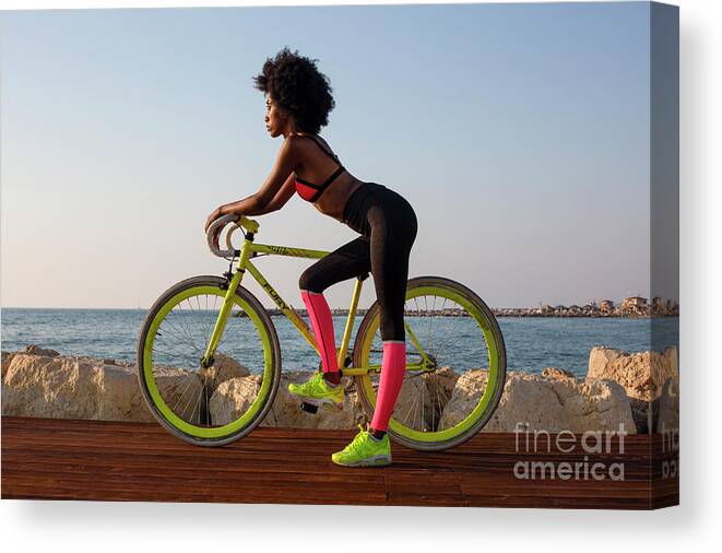 Young Canvas Print featuring the photograph Young athletic woman with bicycle k2 by Ami Siano