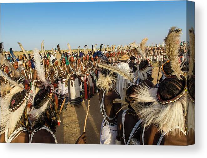People Canvas Print featuring the photograph Young Bororo Men Dancing During Gerewol by Maremagnum