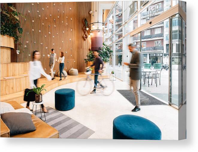 Corporate Business Canvas Print featuring the photograph Commuters arriving to office lobby #1 by Ferrantraite