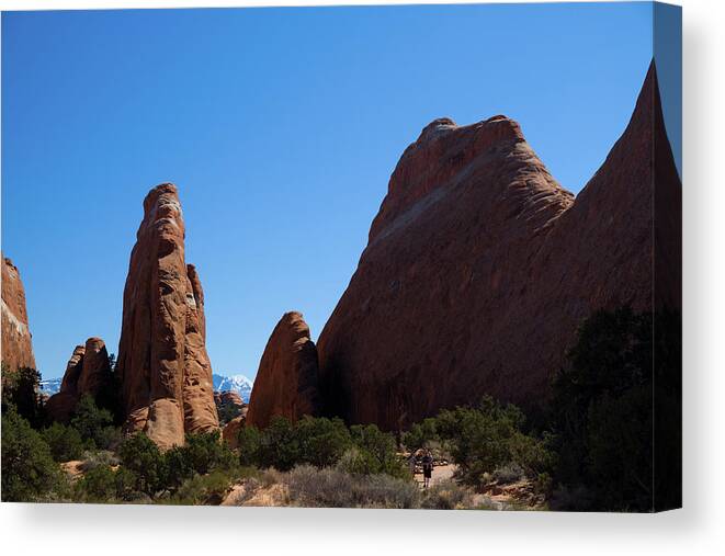 People Canvas Print featuring the photograph Devils Garden Trail in Arches National Park #1 by David L Moore