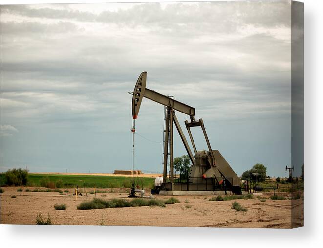 Scenics Canvas Print featuring the photograph Fracking Pumpjacks in the Oil Field #1 by Grandriver