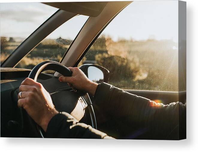Car Interior Canvas Print featuring the photograph Hand holding steering wheel in a Car #1 by Catherine Falls Commercial